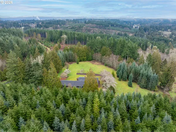 a backyard of a house with a yard and lake view