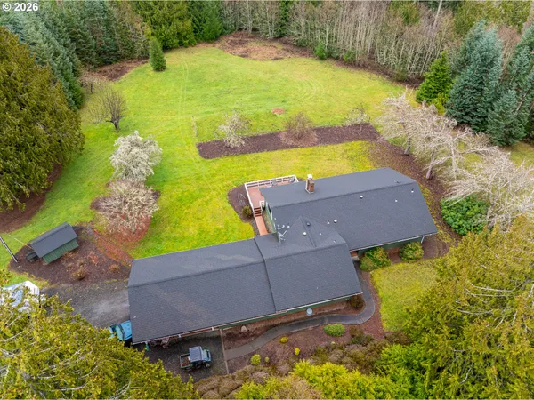an aerial view of a house with a swimming pool