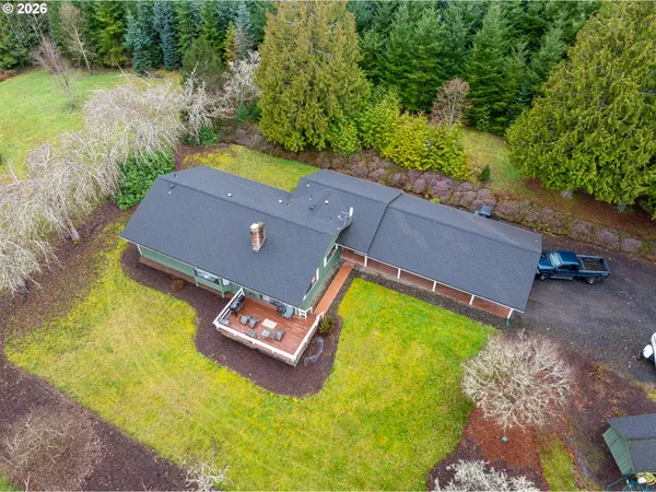 a aerial view of a house with swimming pool yard and outdoor seating