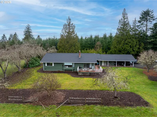 a aerial view of a house with swimming pool having outdoor seating