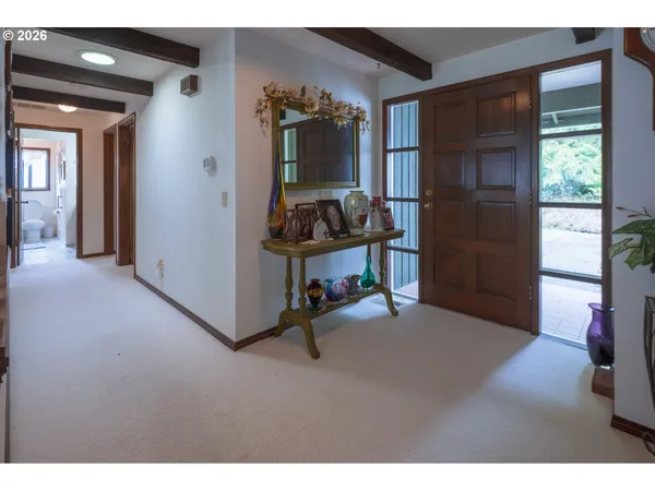a view of entryway and hall with a window