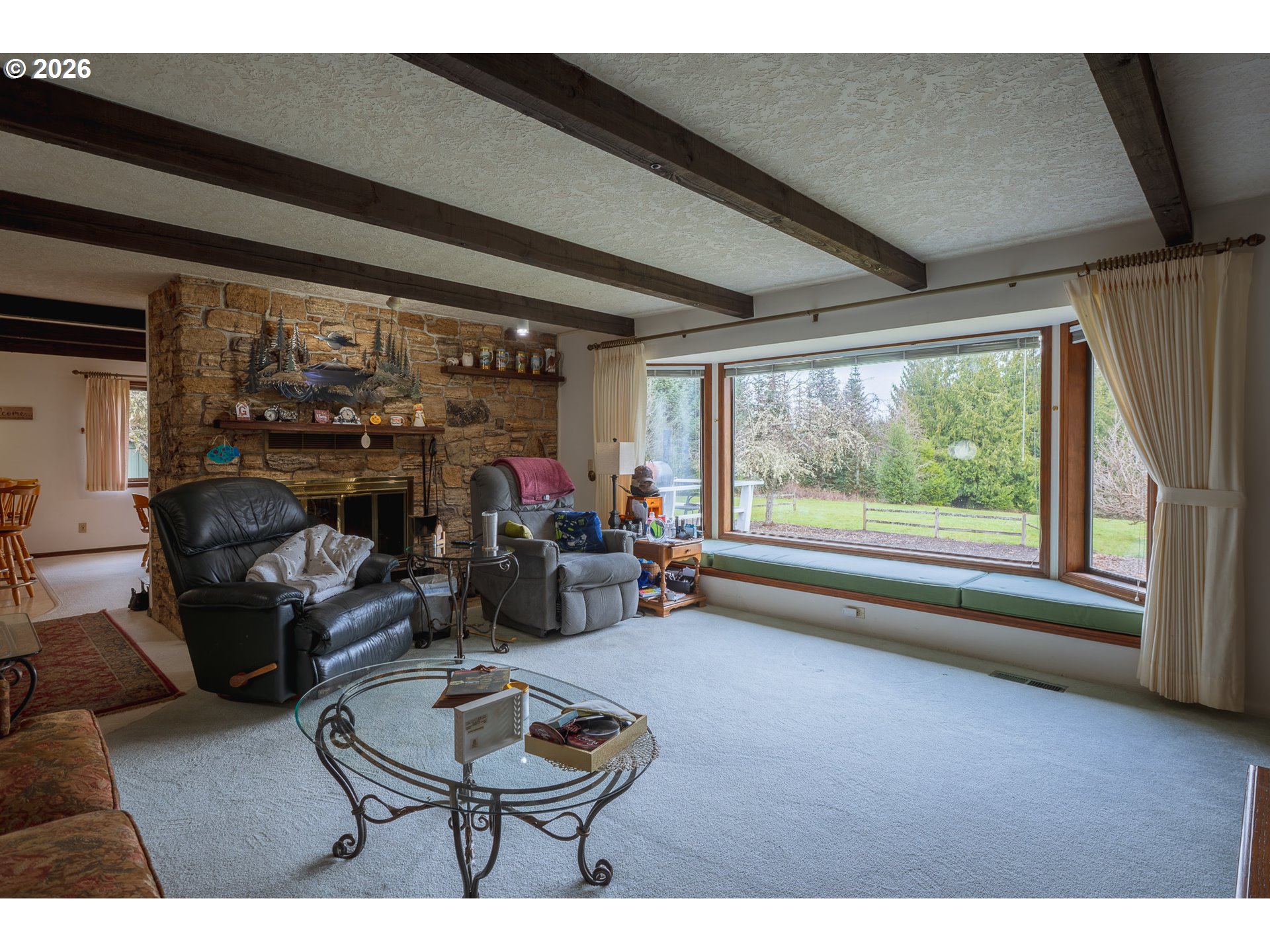 76382 Delena Mayger Road Rainier, OR 97048 - Photo 31 of 36 a living room with furniture and a floor to ceiling window
