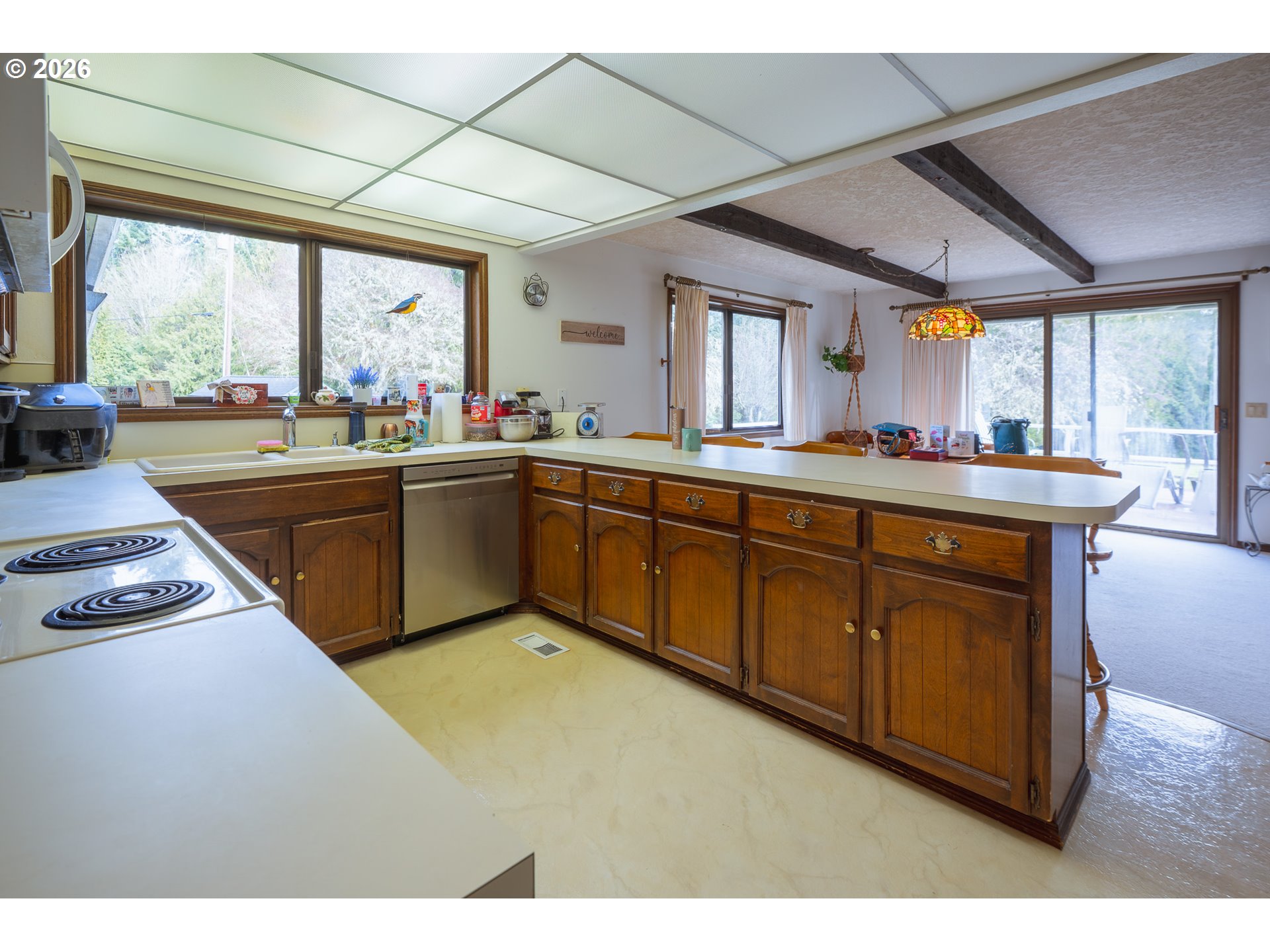 76382 Delena Mayger Road Rainier, OR 97048 - Photo 33 of 36 a kitchen with wooden cabinets sink and window