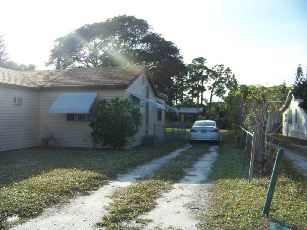 3837 Gulfstream Road Lake Worth, FL 33461 - Photo 32 of 32 Side View of Main House