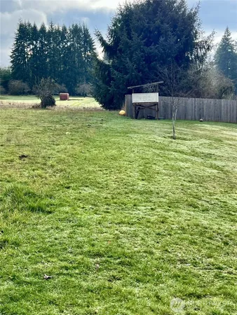 a view of a pool with a yard