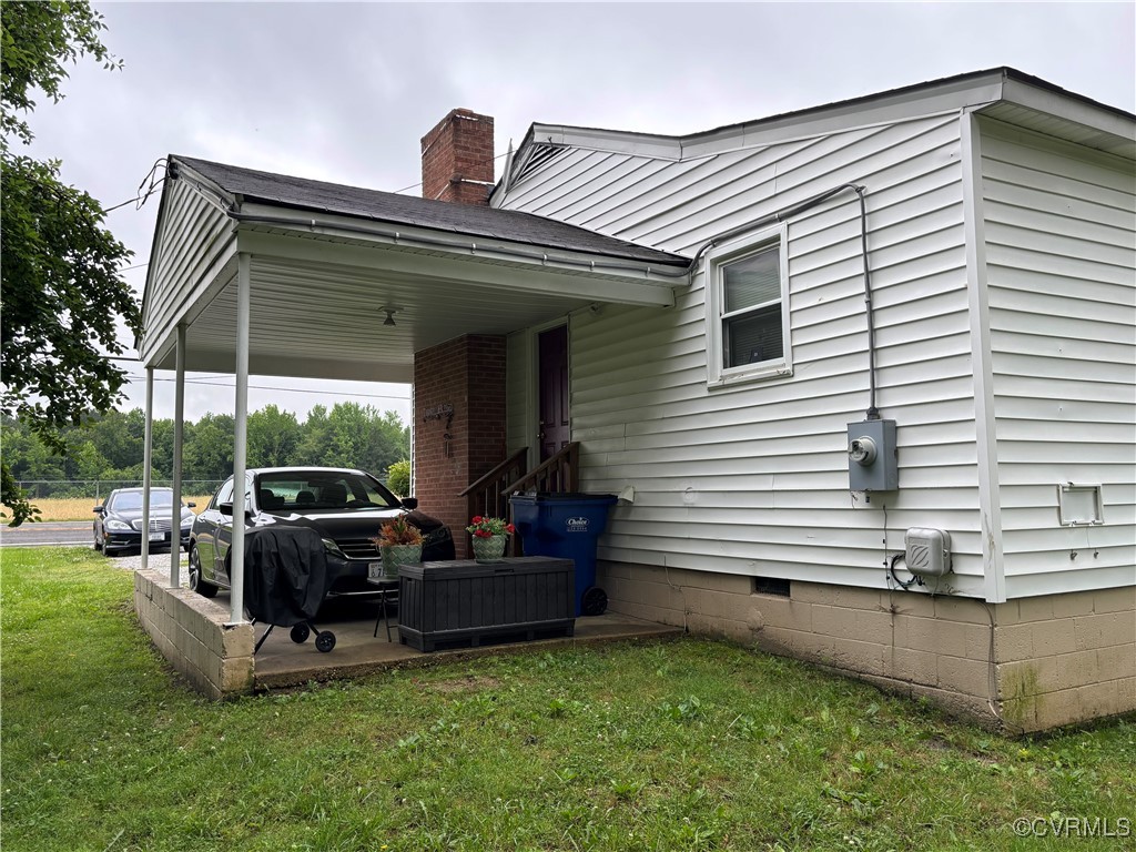4704 River Road Petersburg, VA 23803 - Photo 10 of 17 View of side of home with a yard, crawl space, a c
