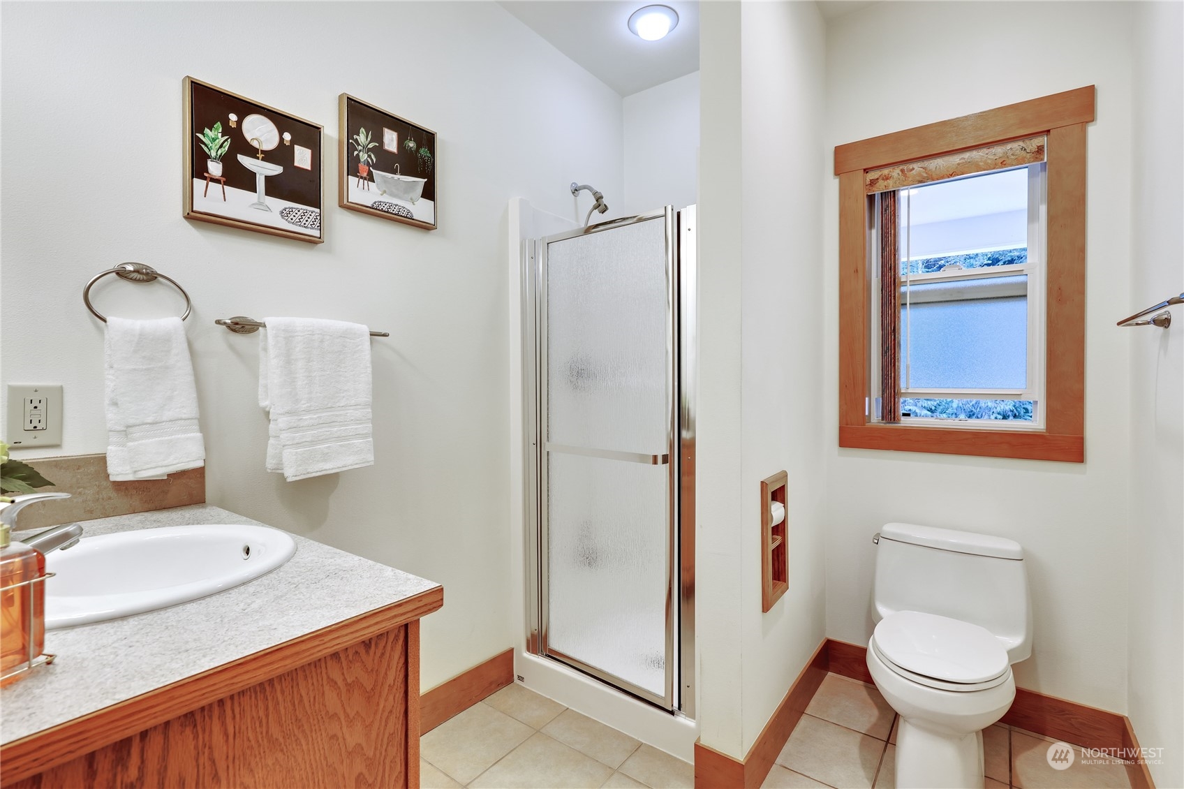 5701 Northeast Gunderson Road Poulsbo, WA 98370 - Photo 11 of 40 a bathroom with a sink toilet and vanity