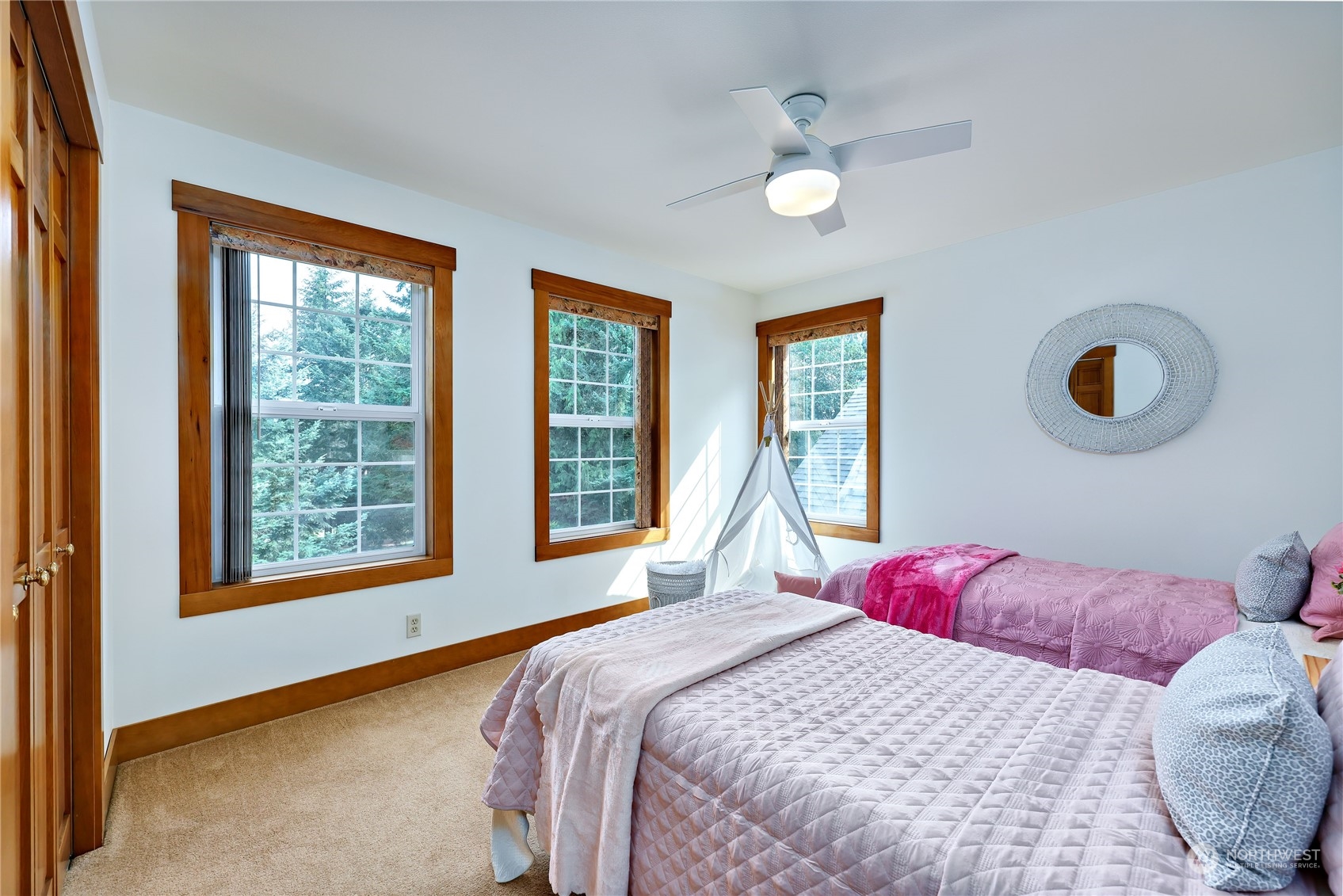 5701 Northeast Gunderson Road Poulsbo, WA 98370 - Photo 12 of 40 a bedroom with a large bed and a large window