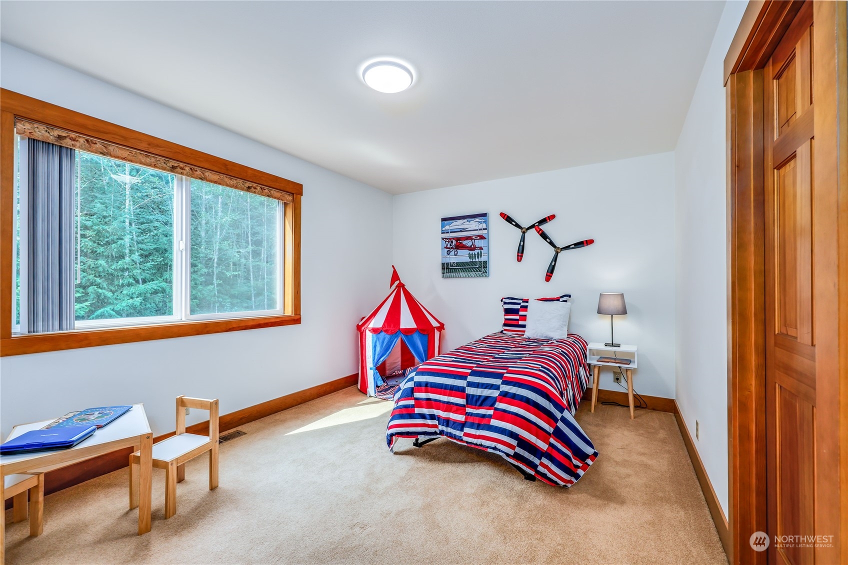 5701 Northeast Gunderson Road Poulsbo, WA 98370 - Photo 13 of 40 a bedroom with a bed and a window