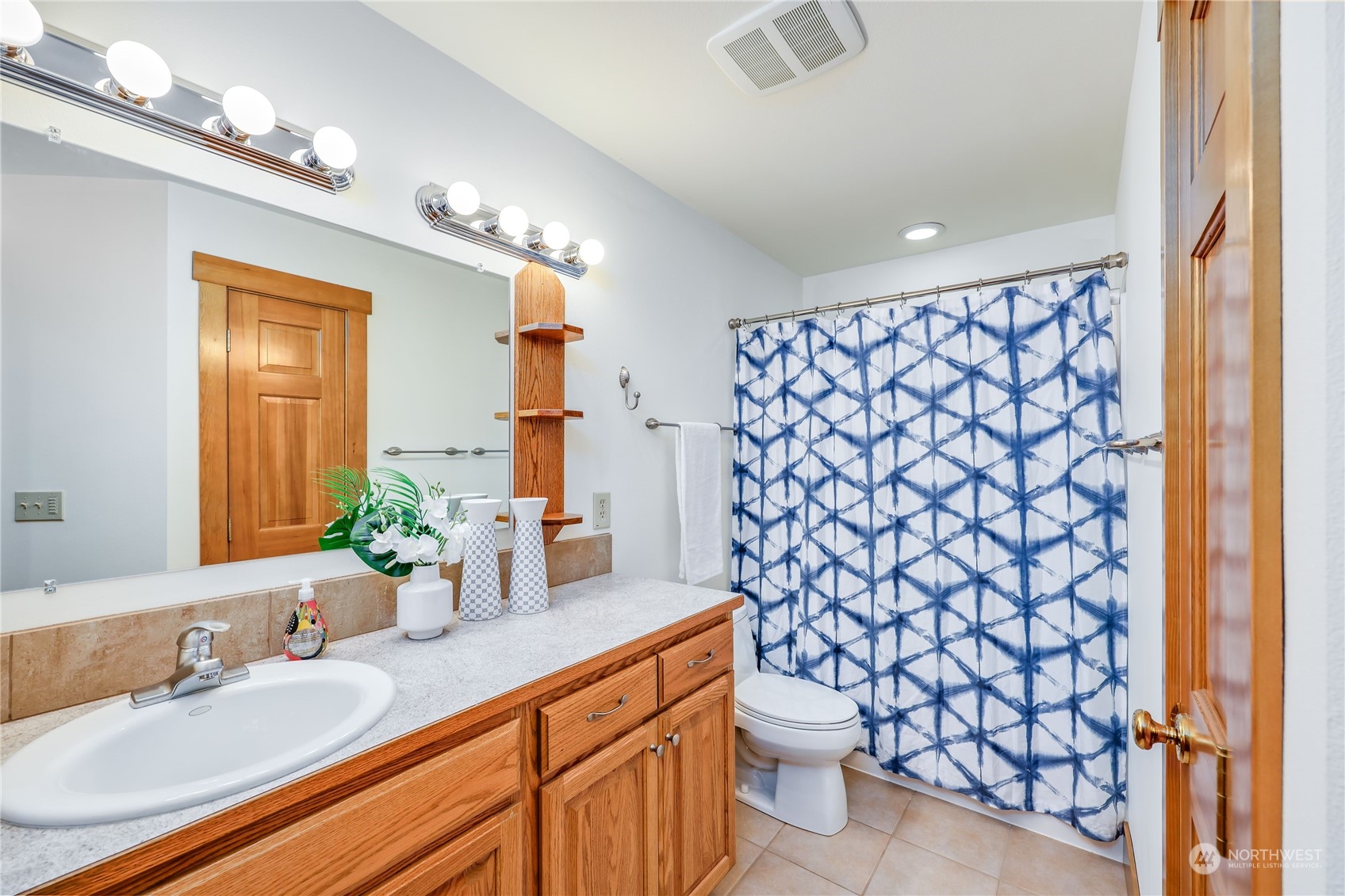 5701 Northeast Gunderson Road Poulsbo, WA 98370 - Photo 15 of 40 a bathroom with a sink and a mirror