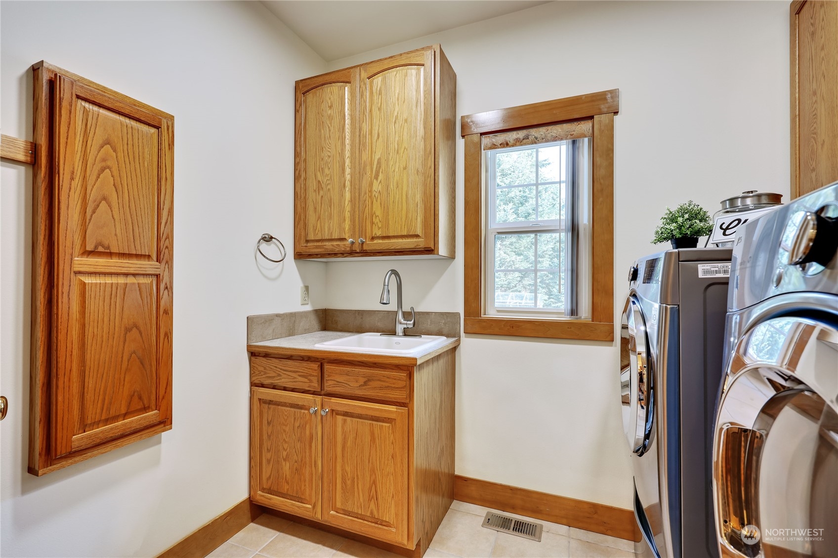 5701 Northeast Gunderson Road Poulsbo, WA 98370 - Photo 16 of 40 a view of a storage and utility room with a window