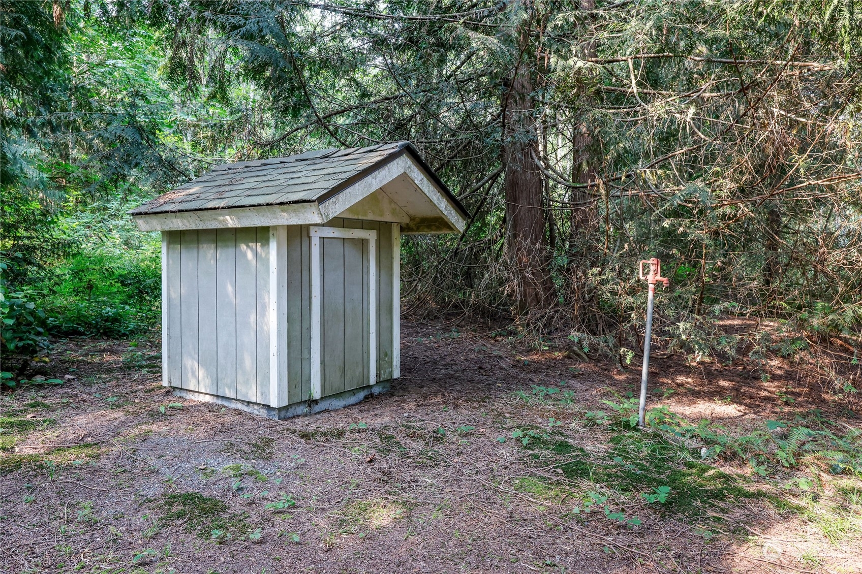 5701 Northeast Gunderson Road Poulsbo, WA 98370 - Photo 19 of 40 a view of a house with backyard