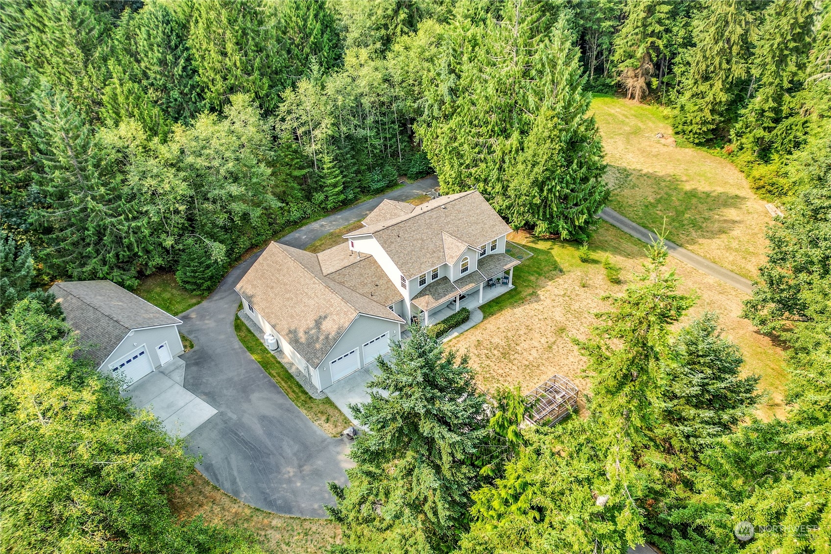 5701 Northeast Gunderson Road Poulsbo, WA 98370 - Photo 24 of 40 an aerial view of residential house with outdoor space