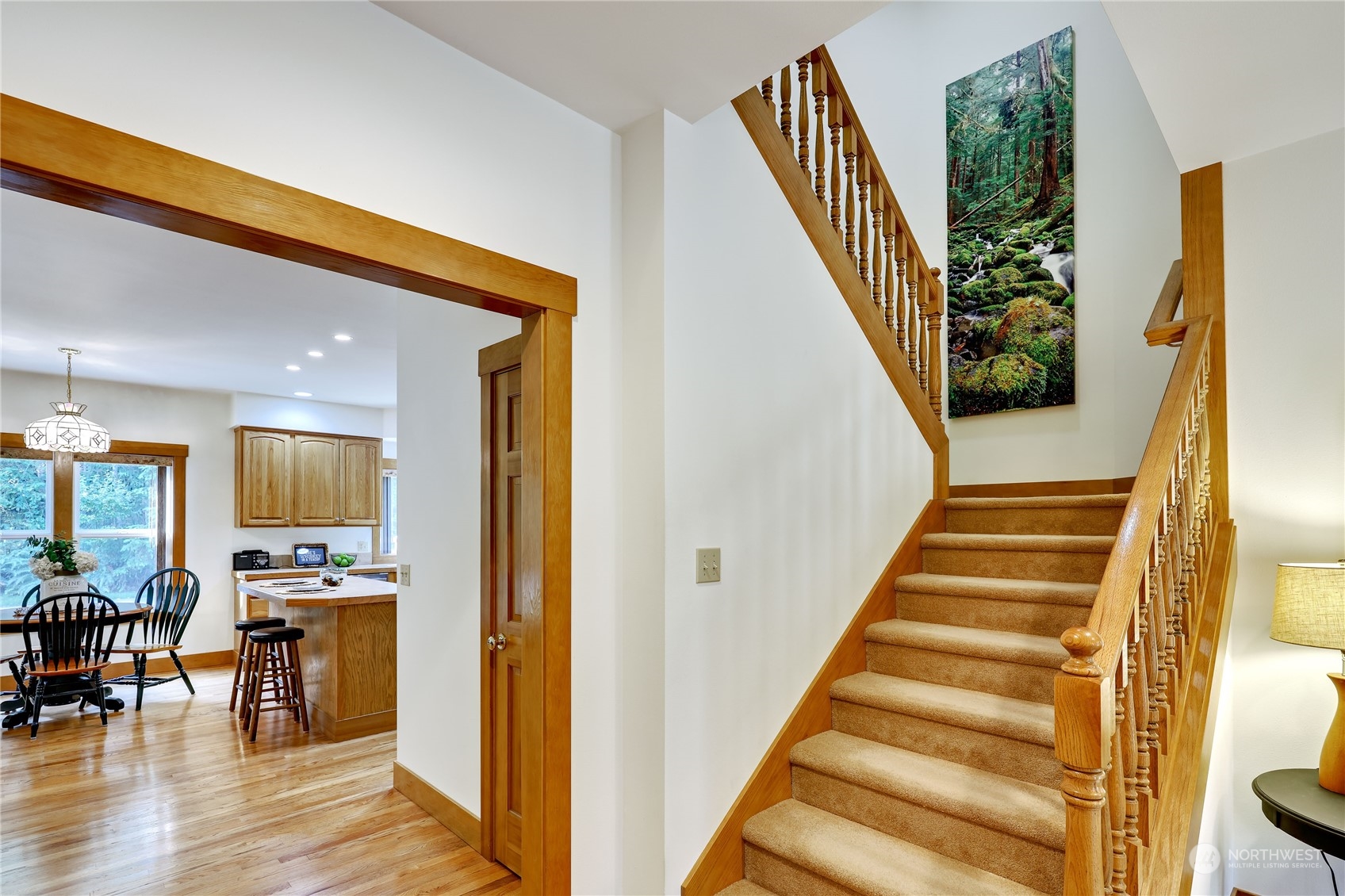 5701 Northeast Gunderson Road Poulsbo, WA 98370 - Photo 26 of 40 a view of an entryway with wooden floor and windows
