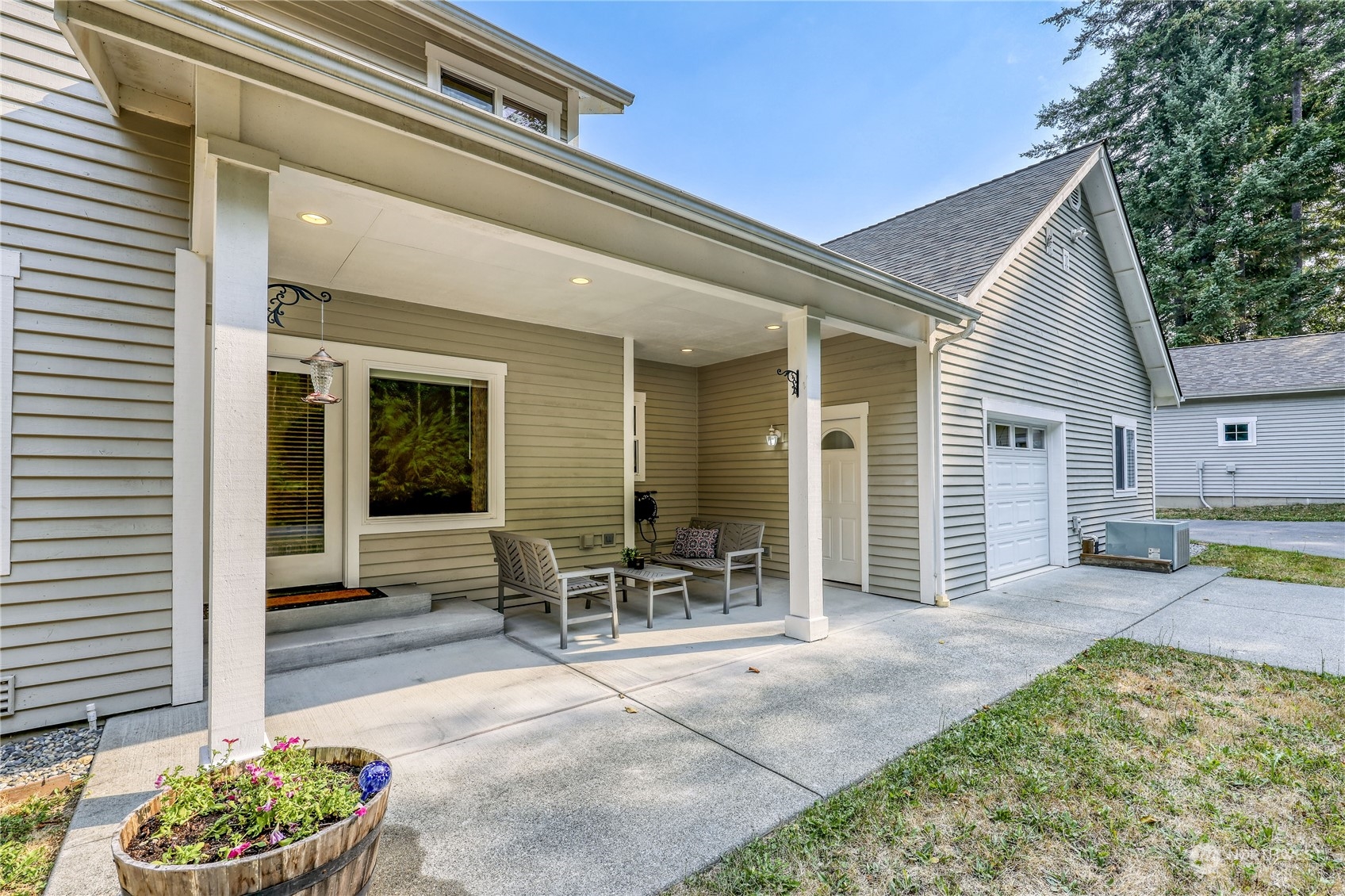 5701 Northeast Gunderson Road Poulsbo, WA 98370 - Photo 28 of 40 a backyard of a house with outdoor seating