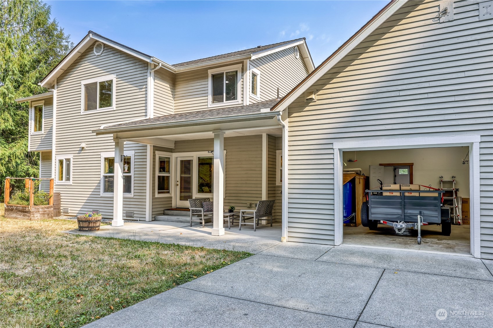 5701 Northeast Gunderson Road Poulsbo, WA 98370 - Photo 29 of 40 a front view of a house with a yard
