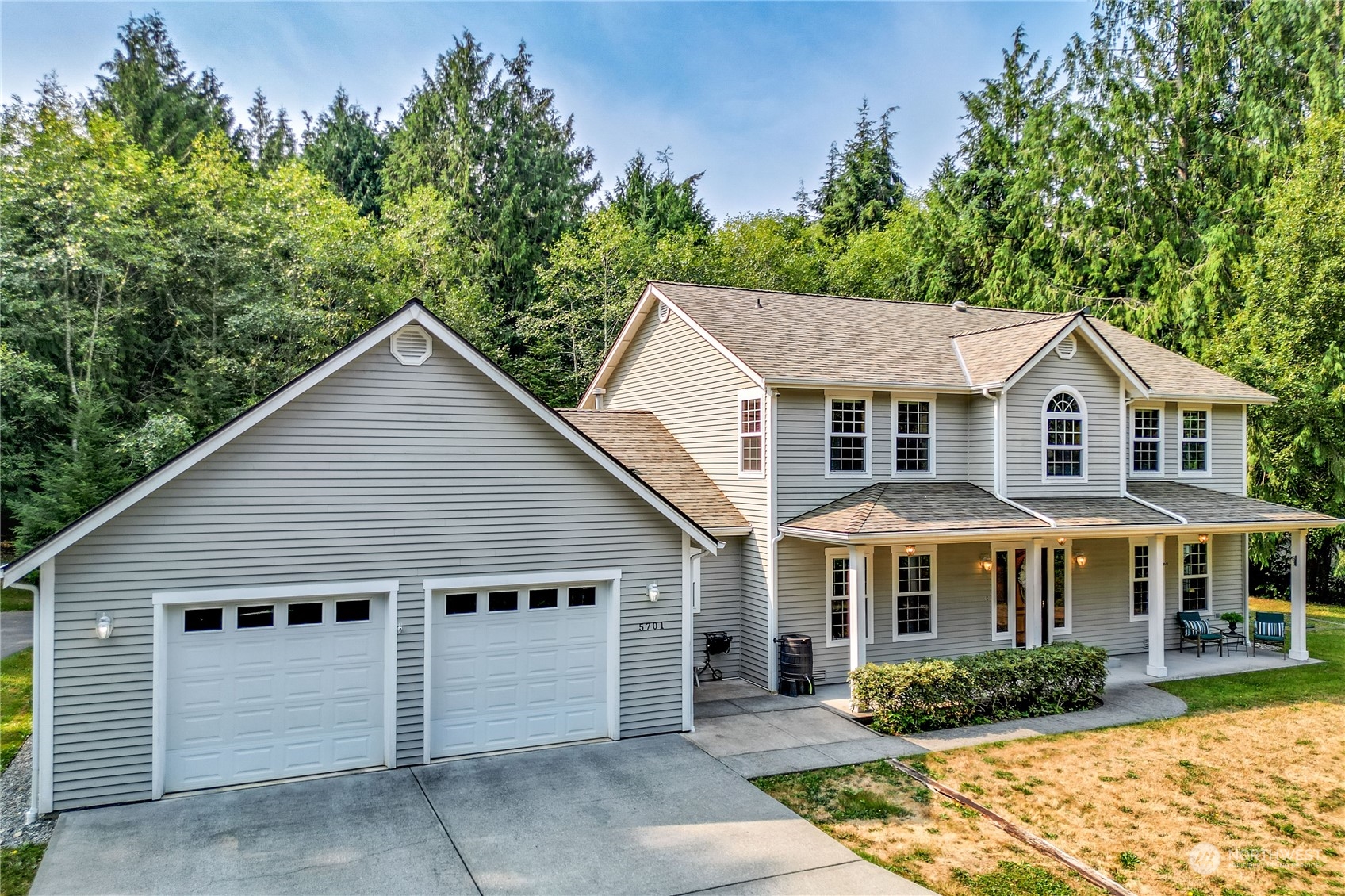5701 Northeast Gunderson Road Poulsbo, WA 98370 - Photo 30 of 40 a front view of a house with yard