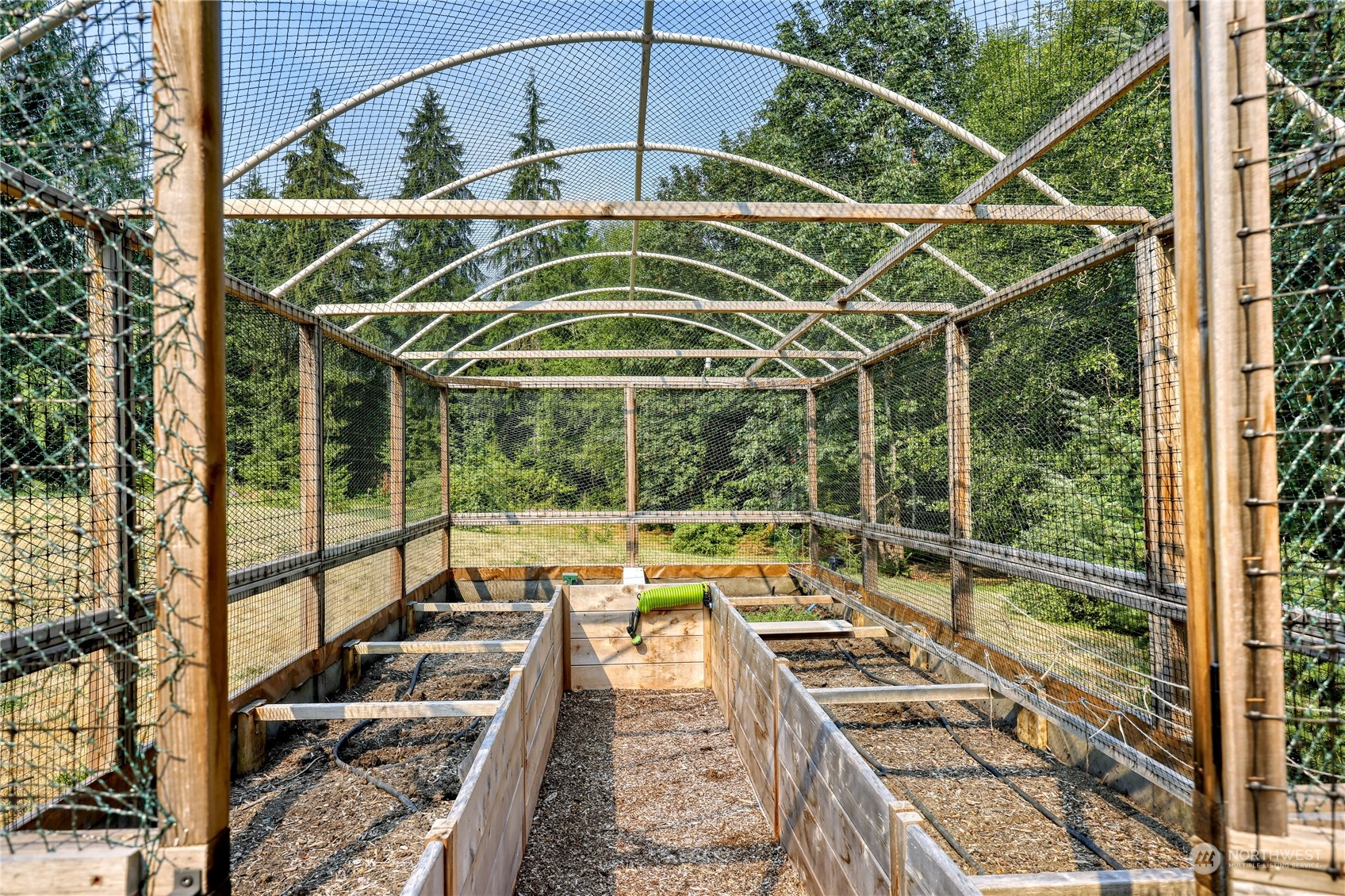 5701 Northeast Gunderson Road Poulsbo, WA 98370 - Photo 31 of 40 a view of a balcony with chairs and wooden floor