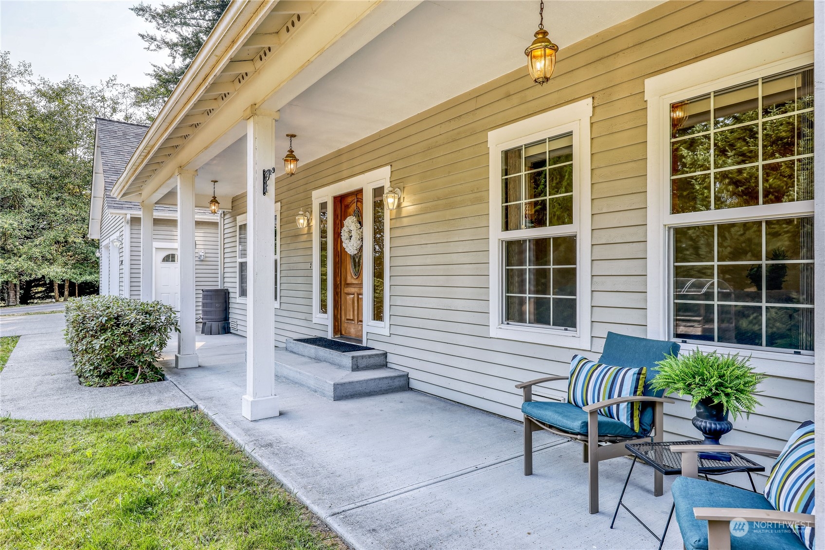 5701 Northeast Gunderson Road Poulsbo, WA 98370 - Photo 33 of 40 a view of a house with backyard and sitting area