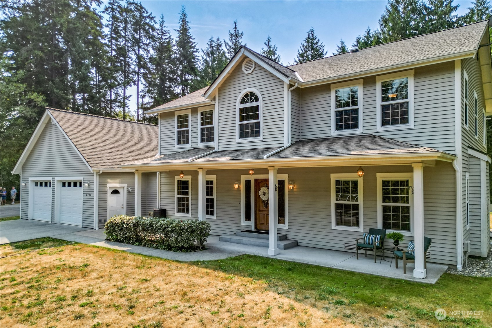 5701 Northeast Gunderson Road Poulsbo, WA 98370 - Photo 39 of 40 a view of a house with a yard