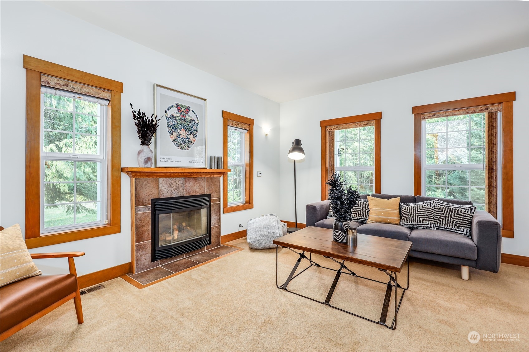 5701 Northeast Gunderson Road Poulsbo, WA 98370 - Photo 4 of 40 a living room with furniture and a fireplace