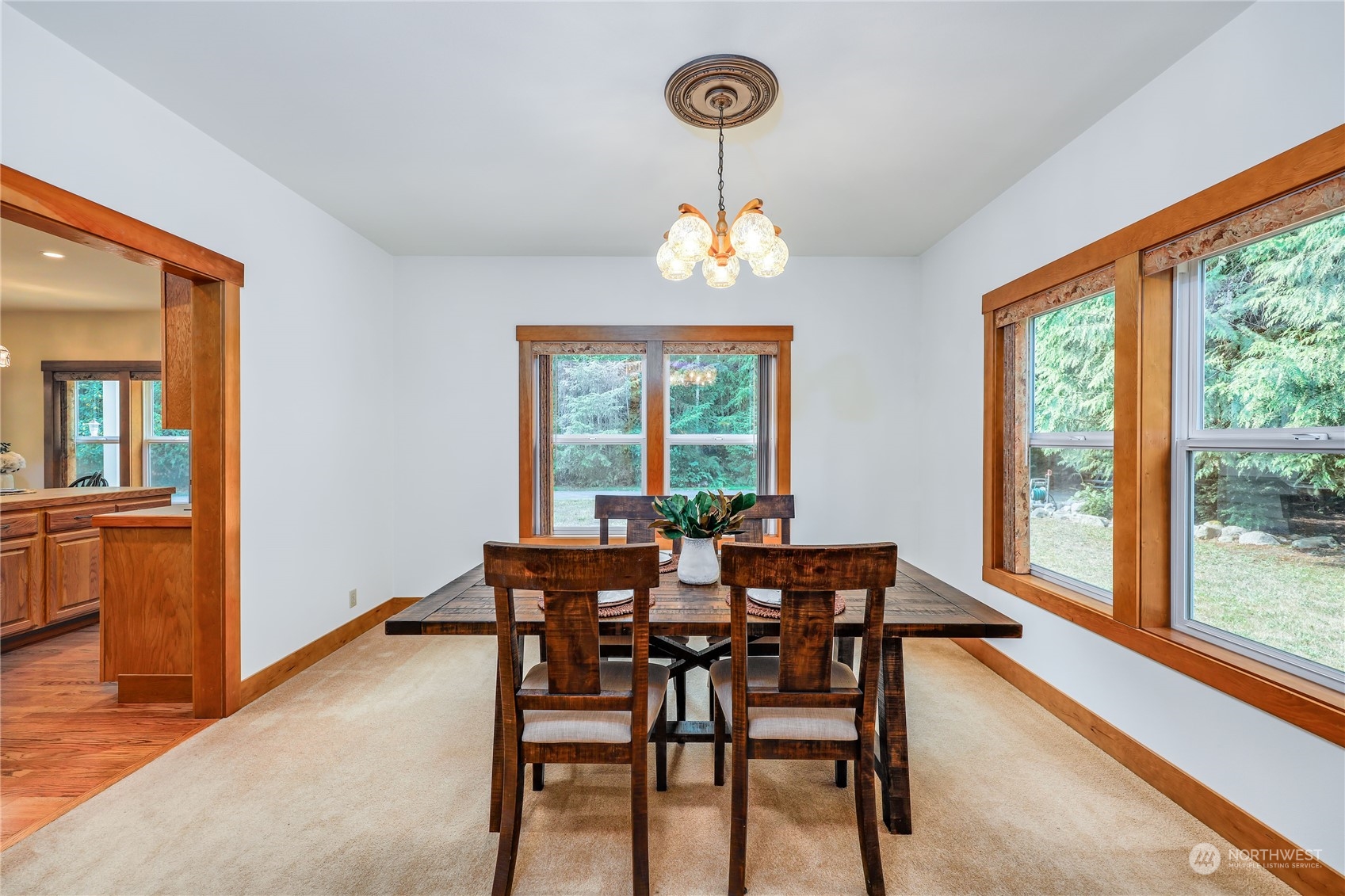 5701 Northeast Gunderson Road Poulsbo, WA 98370 - Photo 5 of 40 a view of a dining room with furniture window and outside view