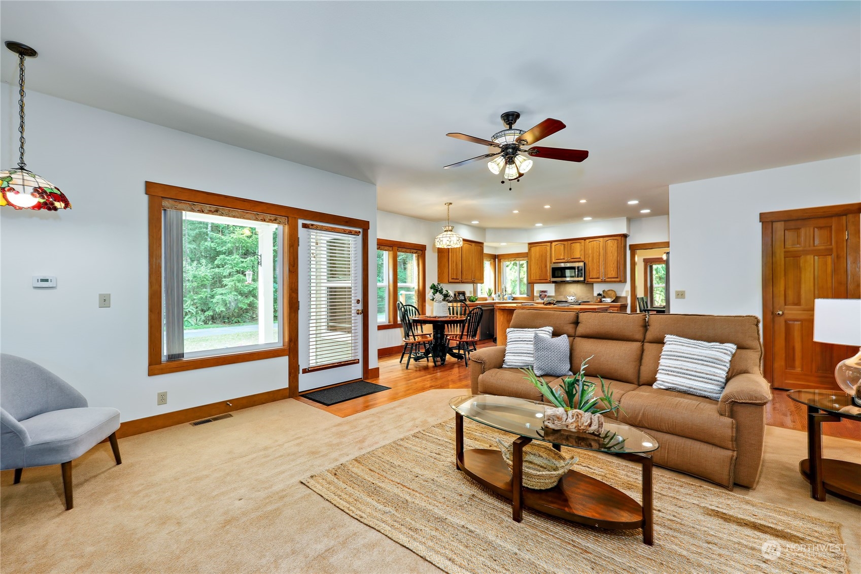 5701 Northeast Gunderson Road Poulsbo, WA 98370 - Photo 7 of 40 a living room with furniture a ceiling fan and a window