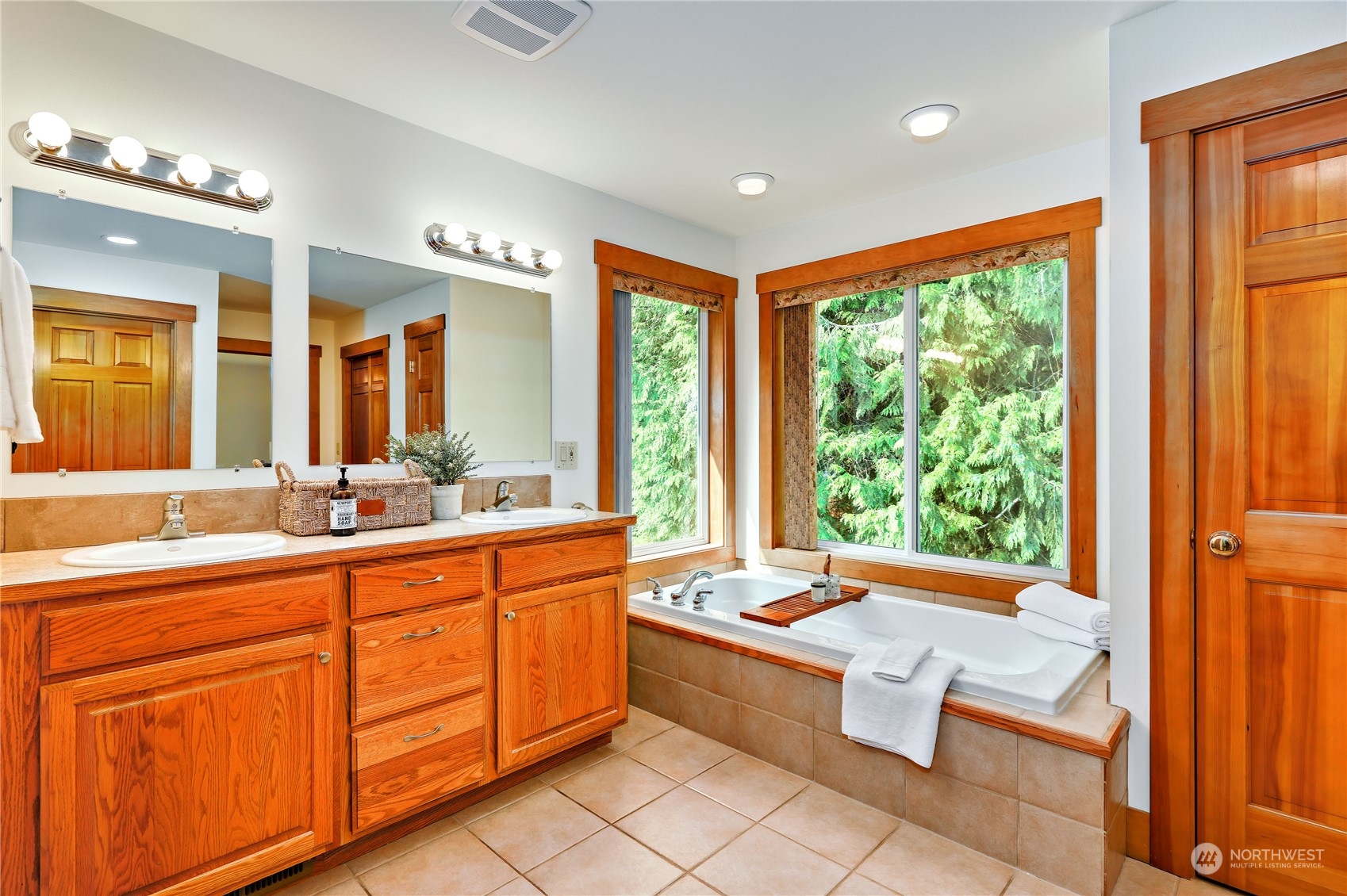 5701 Northeast Gunderson Road Poulsbo, WA 98370 - Photo 10 of 40 a large spacious bathroom with a large tub and sink