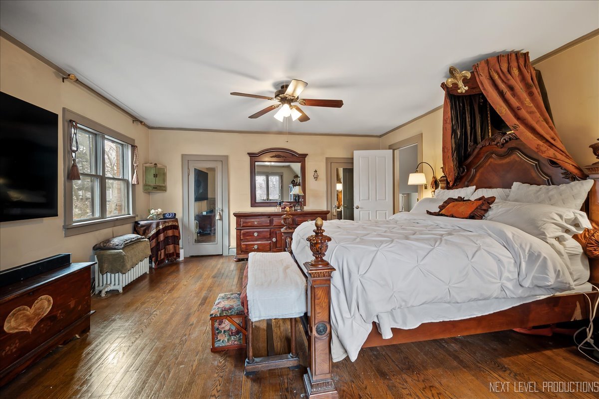 640 Anderson Boulevard Geneva, IL 60134 - Photo 23 of 41 a bedroom with a bed and wooden floor