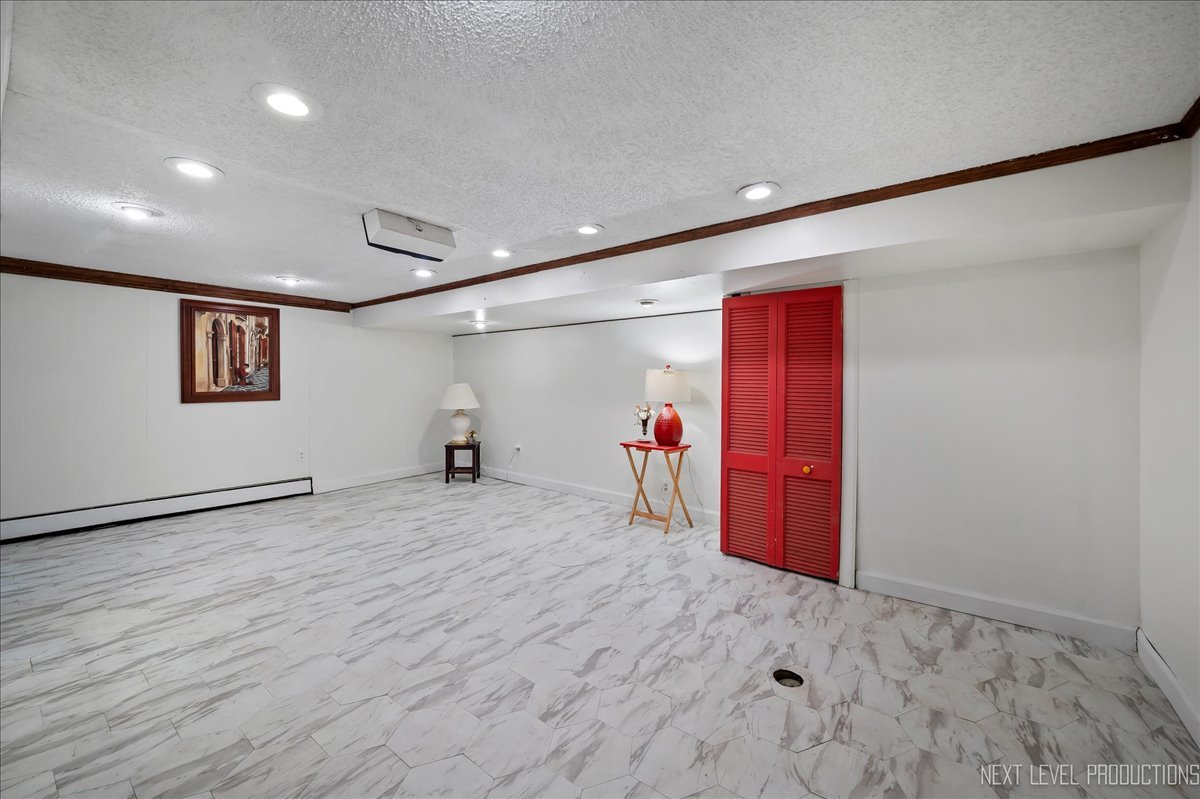 640 Anderson Boulevard Geneva, IL 60134 - Photo 27 of 41 a view of a livingroom with wooden floor and a ceiling fan