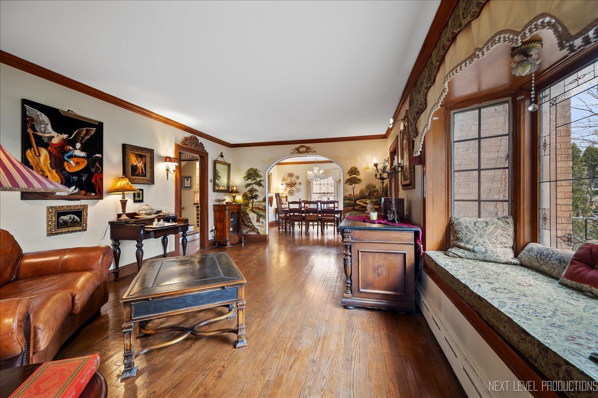 640 Anderson Boulevard Geneva, IL 60134 - Photo 6 of 41 a living room with fireplace furniture and a wooden floor