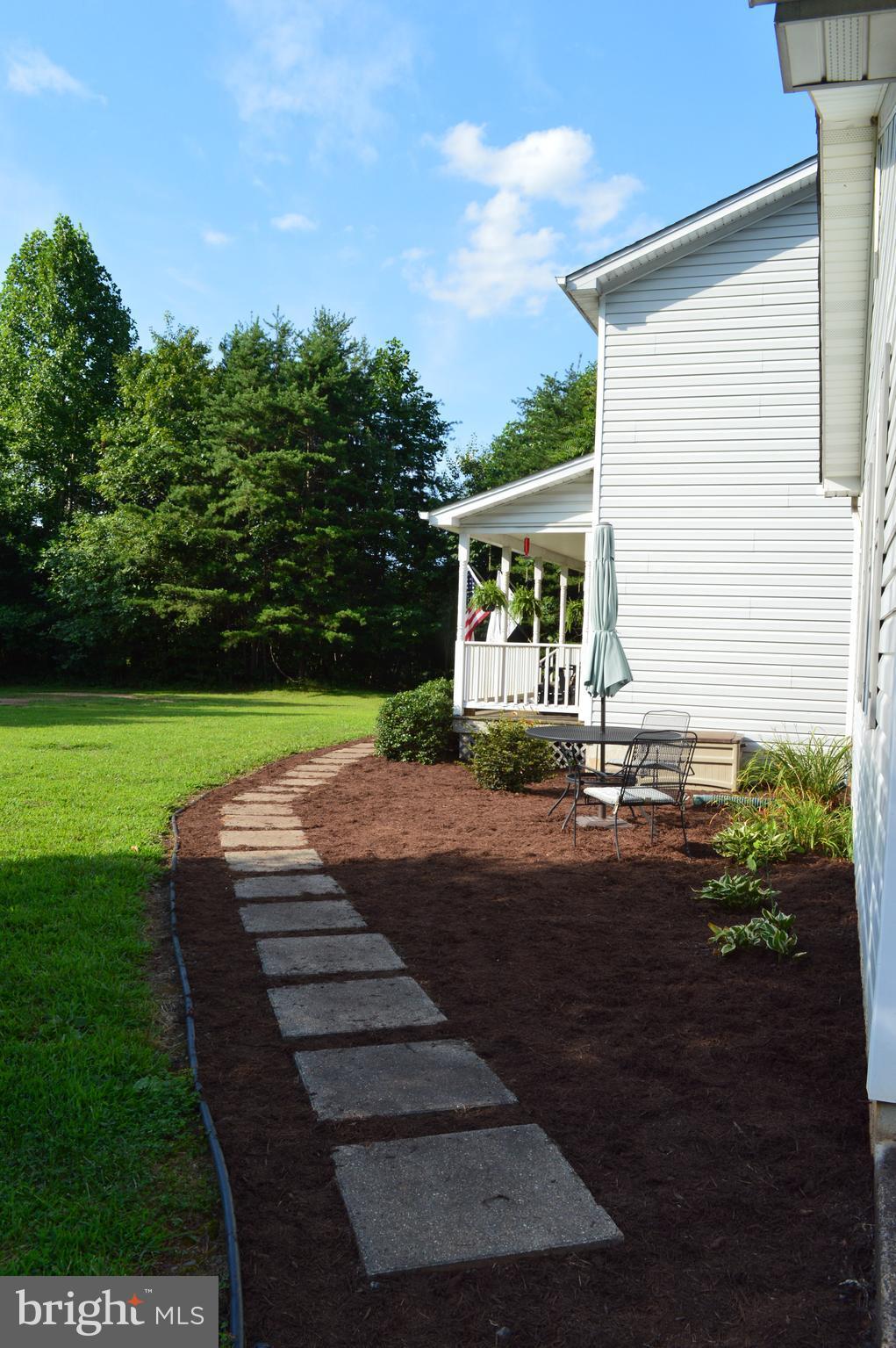 9015 Old Stillhouse Road Rixeyville, VA 22737 - Photo 17 of 21 a view of a house with backyard and garden