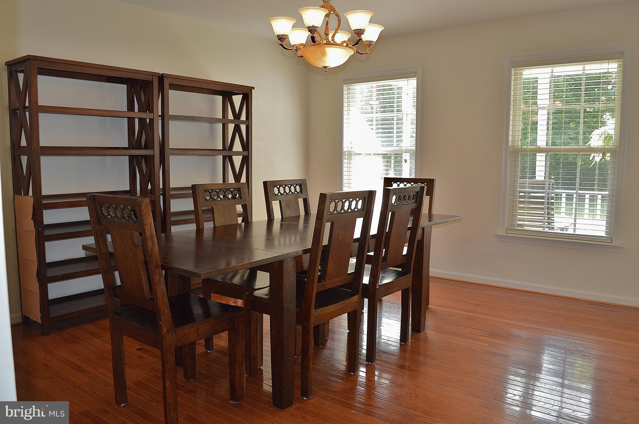 9015 Old Stillhouse Road Rixeyville, VA 22737 - Photo 3 of 21 a view of a dining room with furniture and wooden floor
