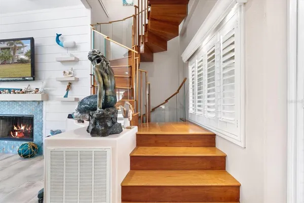 a bedroom with a bed and a large mirror on the dresser