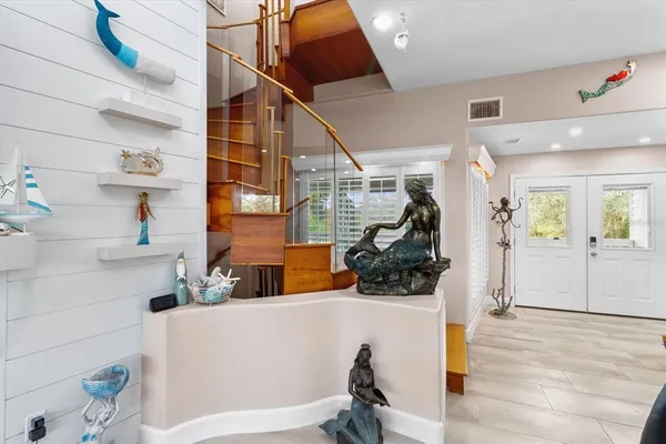 a bathroom with a shower and a glass door