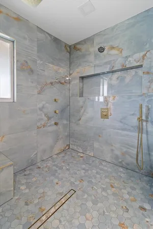 a bathroom with a sink a toilet and shower curtain