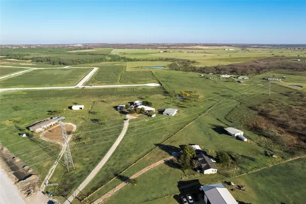 an aerial view of a houses with a outdoor space