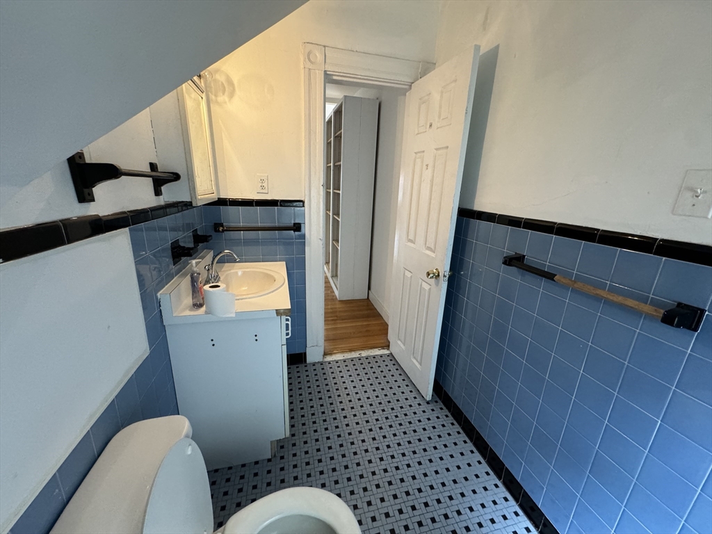 20 South Street, Unit 2 Boston, MA 02135 - Photo 12 of 21 a bathroom with a sink and mirror