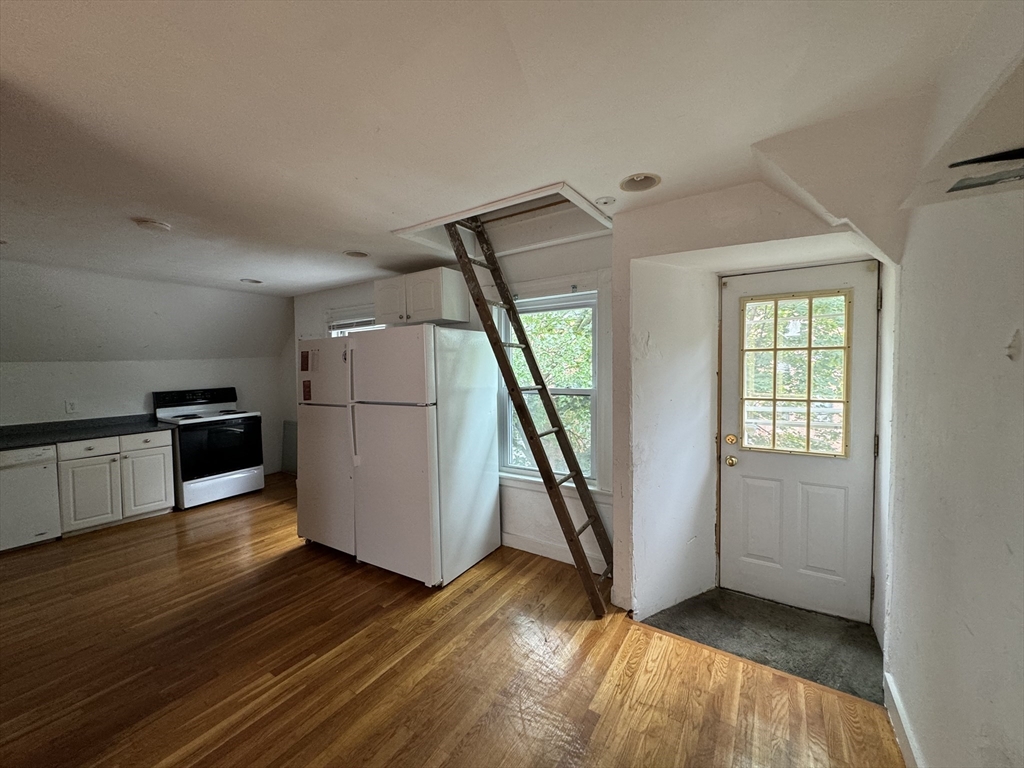 20 South Street, Unit 2 Boston, MA 02135 - Photo 13 of 21 a view of a kitchen with wooden floor and electronic appliances