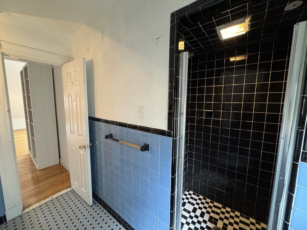 20 South Street, Unit 2 Boston, MA 02135 - Photo 17 of 21 a bathroom with a glass door shower