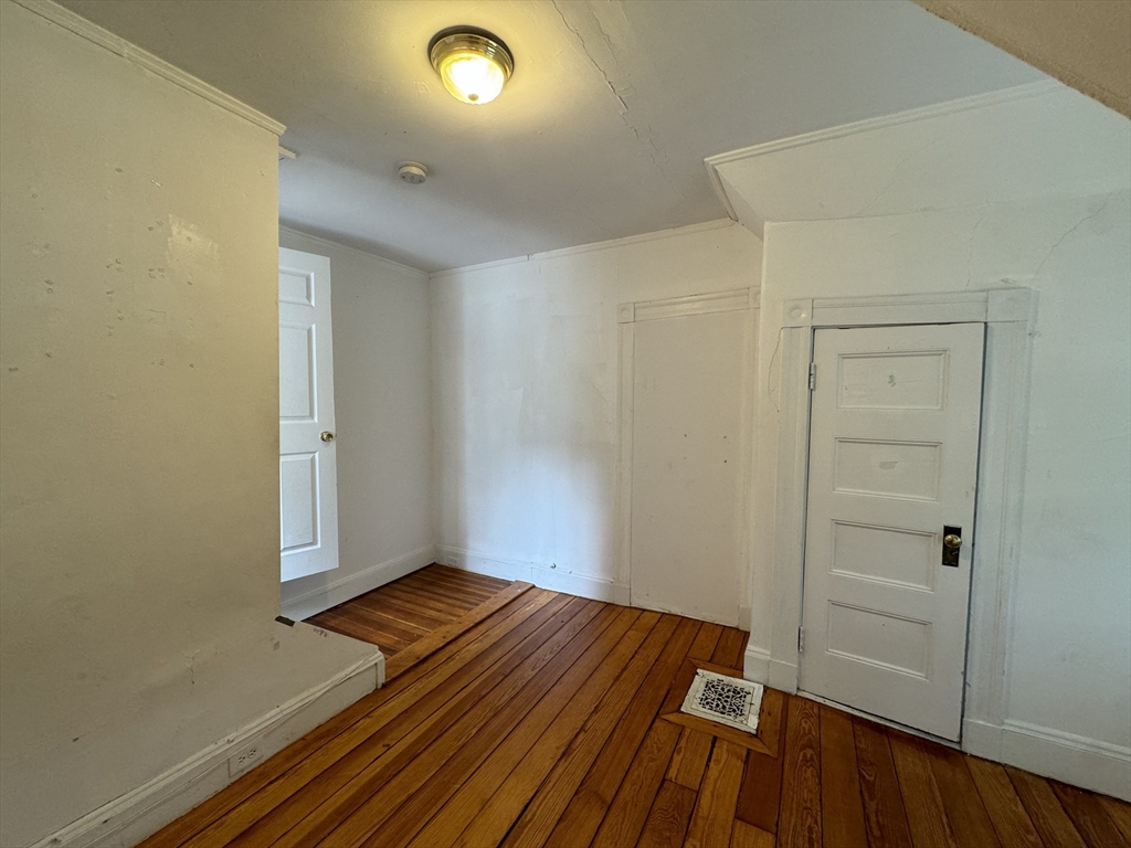 20 South Street, Unit 2 Boston, MA 02135 - Photo 20 of 21 wooden floor in an empty room