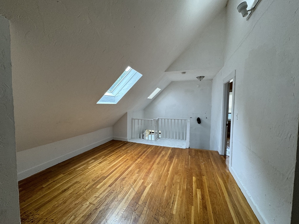 20 South Street, Unit 2 Boston, MA 02135 - Photo 2 of 21 a view of empty room with wooden floor