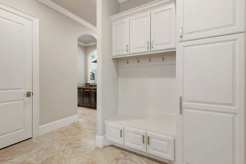 a view of a kitchen with refrigerator and cabinet