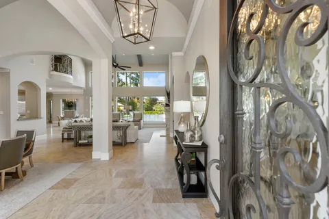a view of a livingroom with furniture and a chandelier
