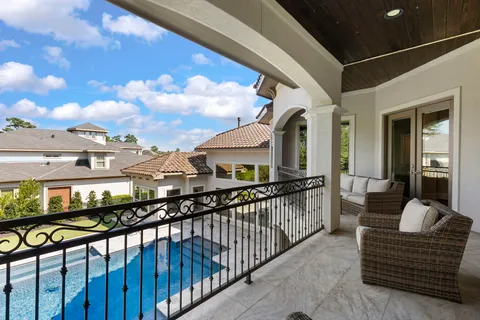 a view of a balcony with furniture
