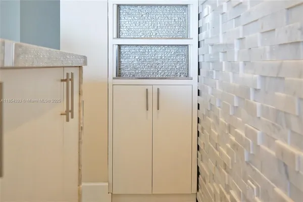 a view of a patio with table and chairs potted plants