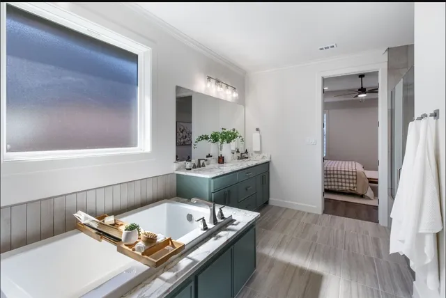 a open kitchen with stainless steel appliances kitchen island granite countertop a refrigerator dining table and chairs