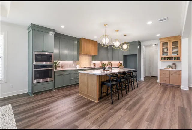 a view of a dining room with furniture wooden floor and chandelier