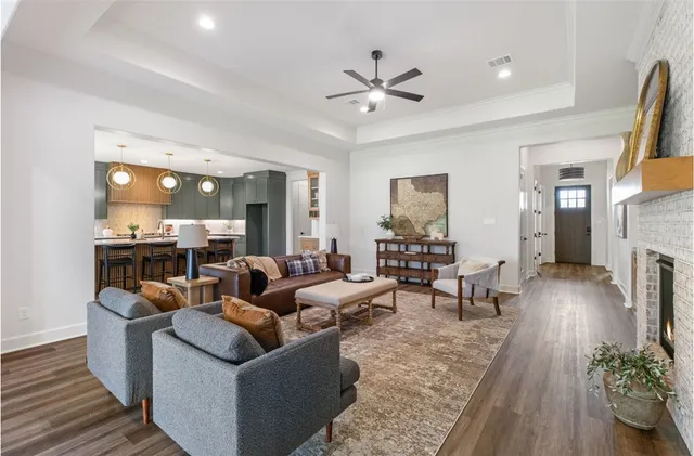 a spacious bedroom with a bed and a chandelier