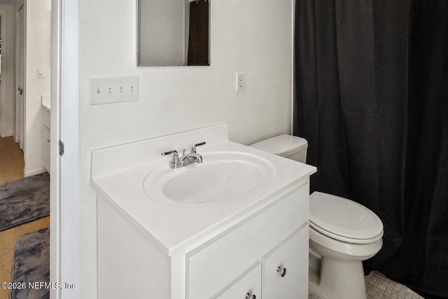 8012 Hollyridge Road, Unit 17U Jacksonville, FL 32256 - Photo 15 of 22 a bathroom with a sink and a toilet